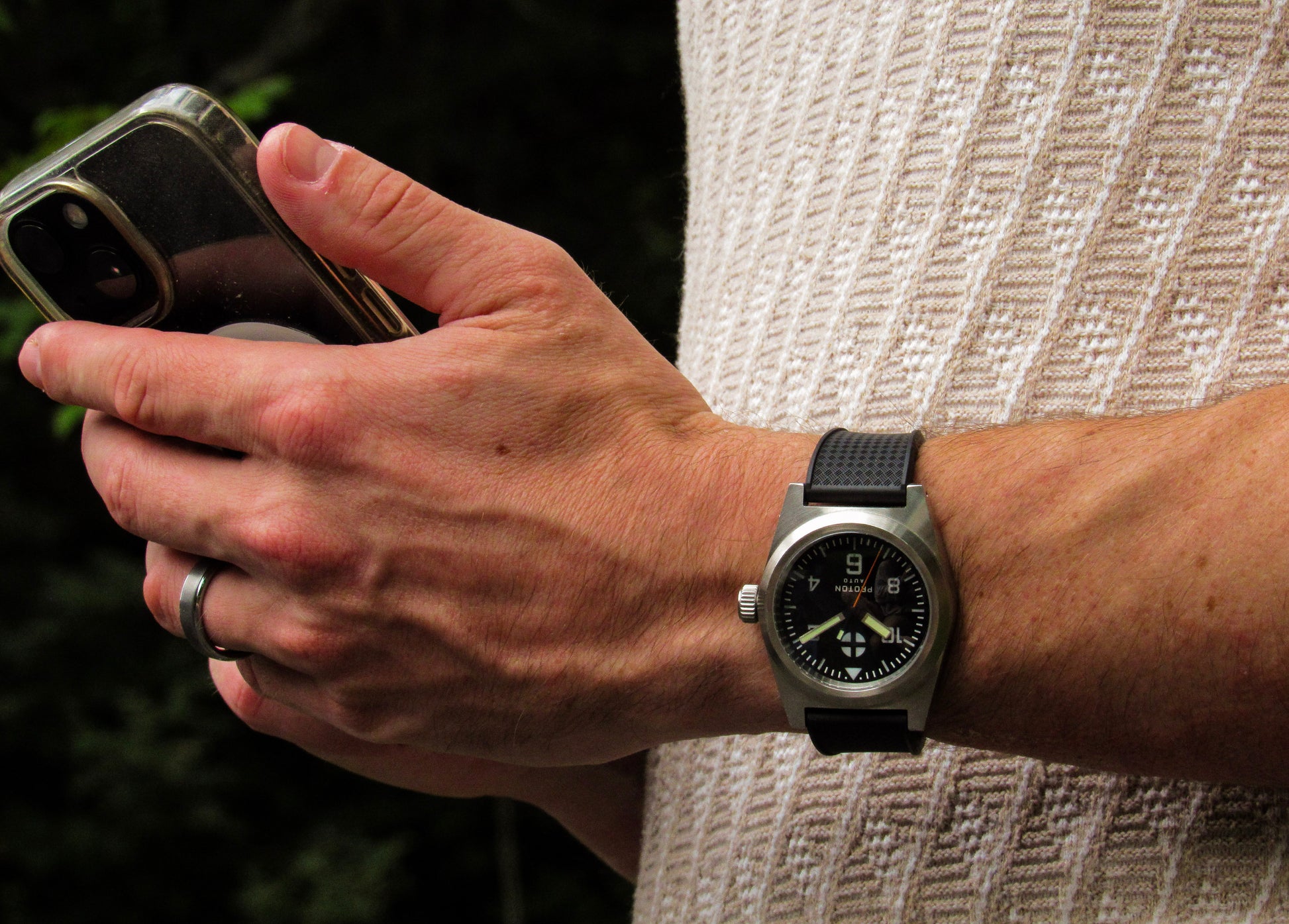 Automatic field watch with rubber strap on wrist