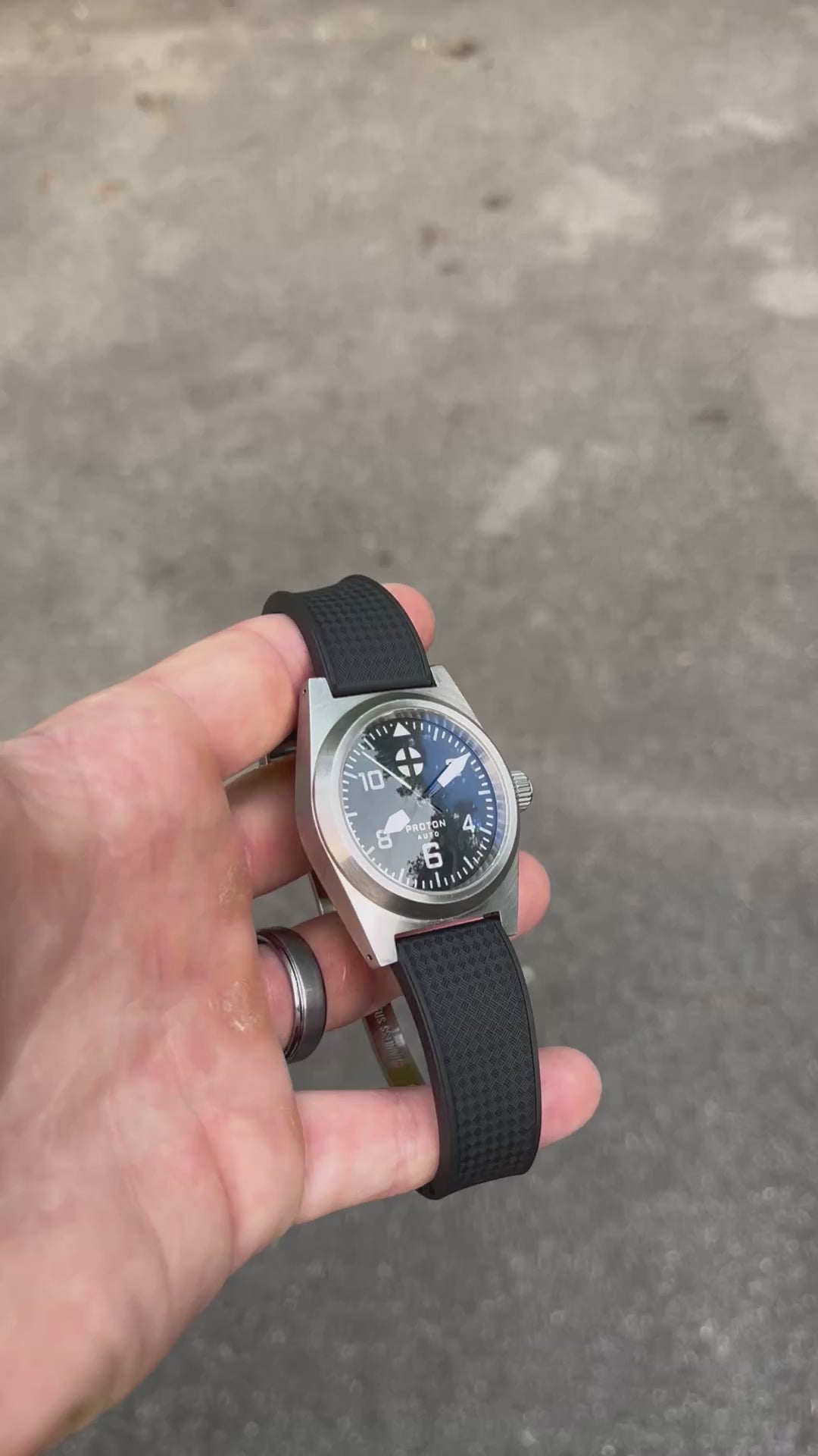 Video of automatic mechanical watch on black rubber strap and domed sapphire crystal